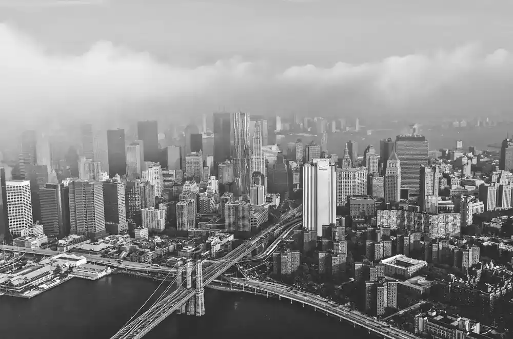 Aerial view of Manhattan and the East River bridges in fog